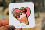 Ice cream cone design on a card held by a hand.