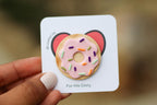 Card with a donut design and 'For His Glory' text held by a hand.