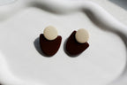 Pair of stud earrings with brown base