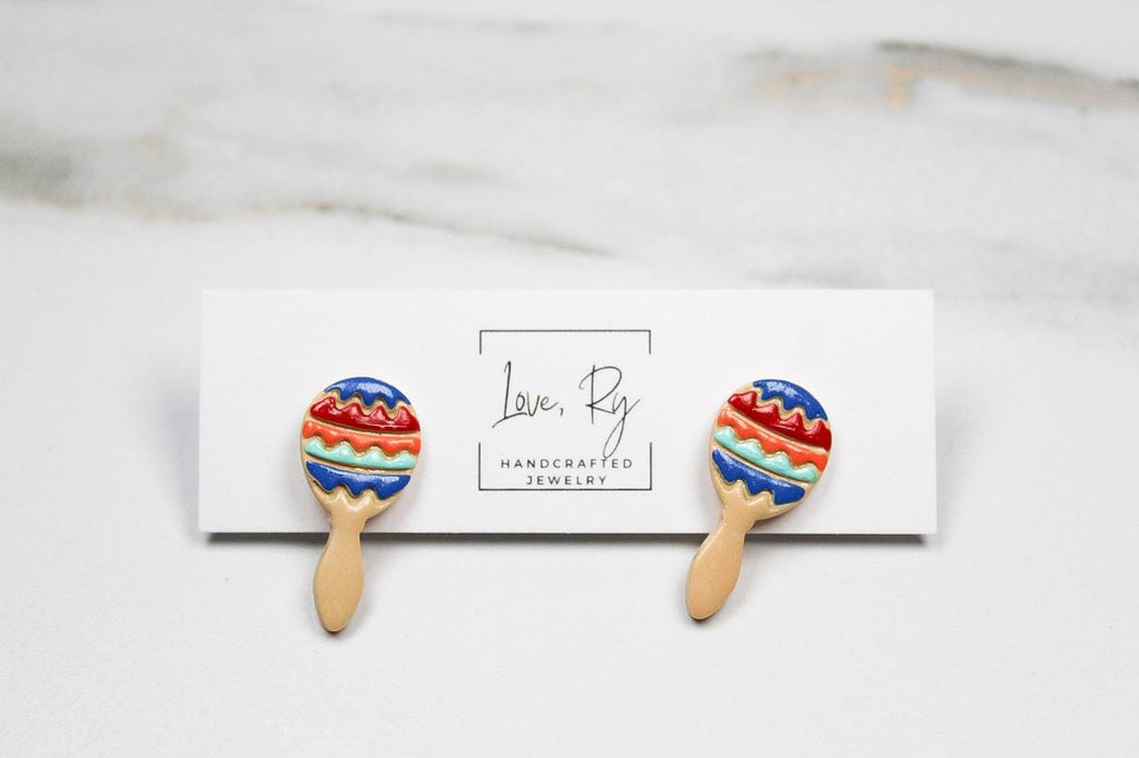 Colorful maraca-shaped earrings on a card with 'Love Ry Handcrafted Jewelry' branding.